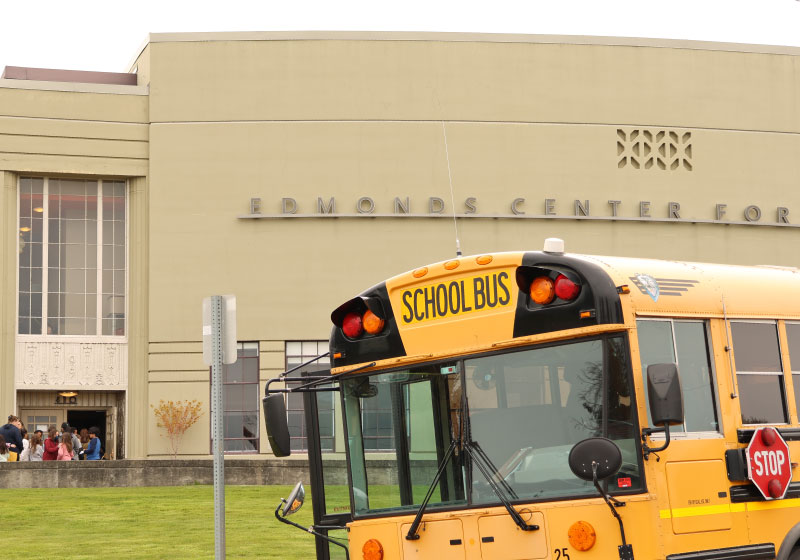 a school bus in front of the theater